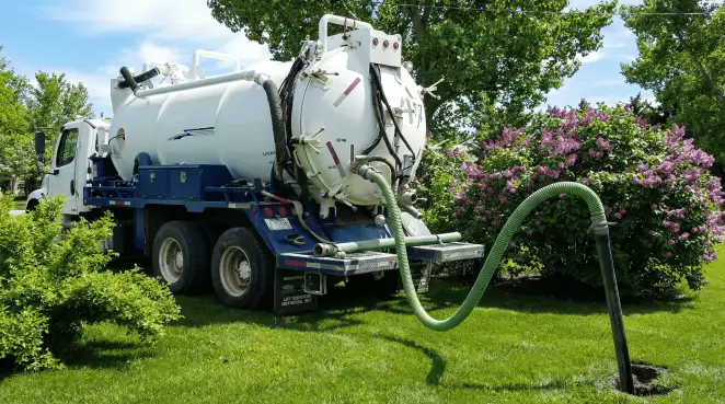 Professional vacuum truck performing residential drainage and septic maintenance in Allentown, PA